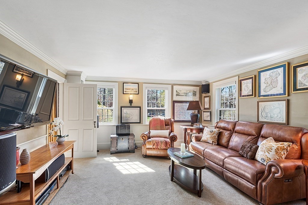 65 Lawrence Road Boxford, MA 01921 - Photo 19 of 36 a living room with furniture and a flat screen tv
