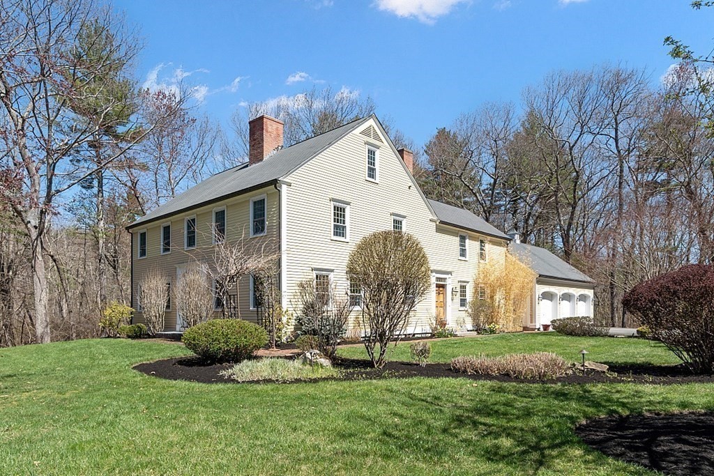 65 Lawrence Road Boxford, MA 01921 - Photo 2 of 36 a front view of a house with a yard and garage