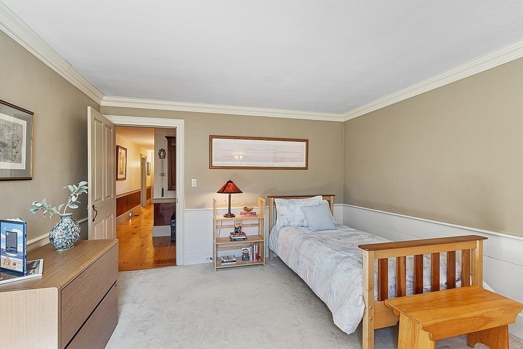 65 Lawrence Road Boxford, MA 01921 - Photo 27 of 36 a bedroom with furniture and a window
