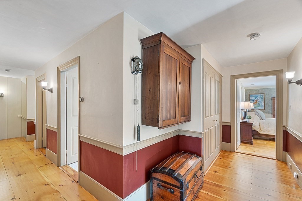65 Lawrence Road Boxford, MA 01921 - Photo 29 of 36 a living room with furniture and a wooden floor