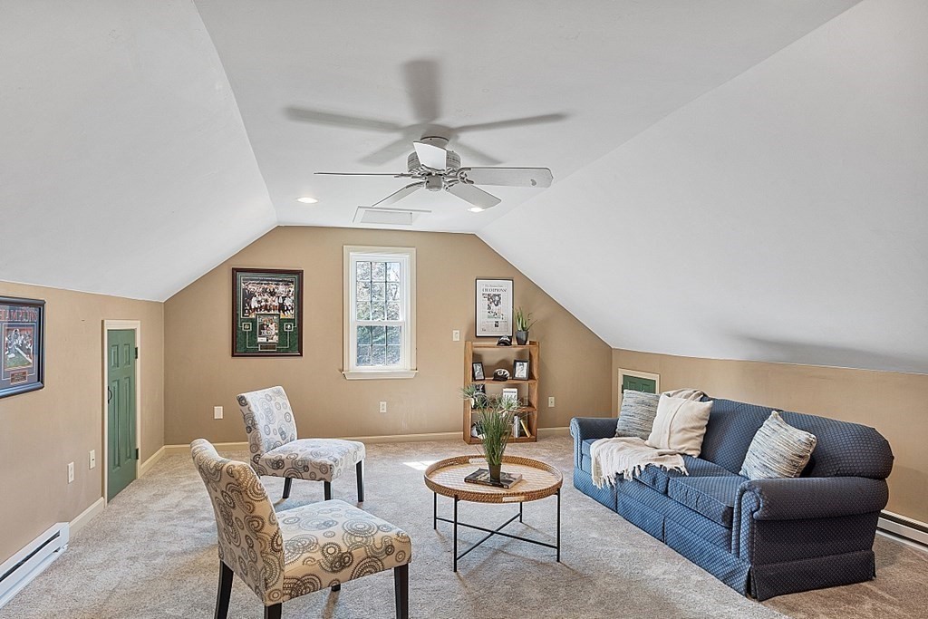 65 Lawrence Road Boxford, MA 01921 - Photo 31 of 36 a living room with furniture and a chandelier