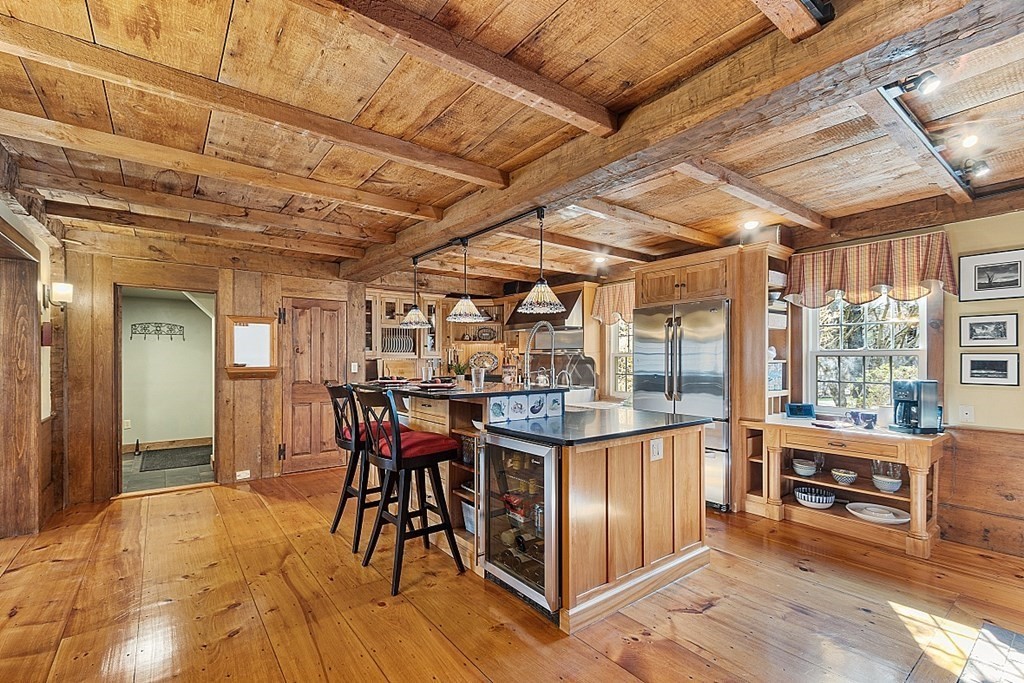 65 Lawrence Road Boxford, MA 01921 - Photo 5 of 36 a view of a dining room with furniture window and wooden floor