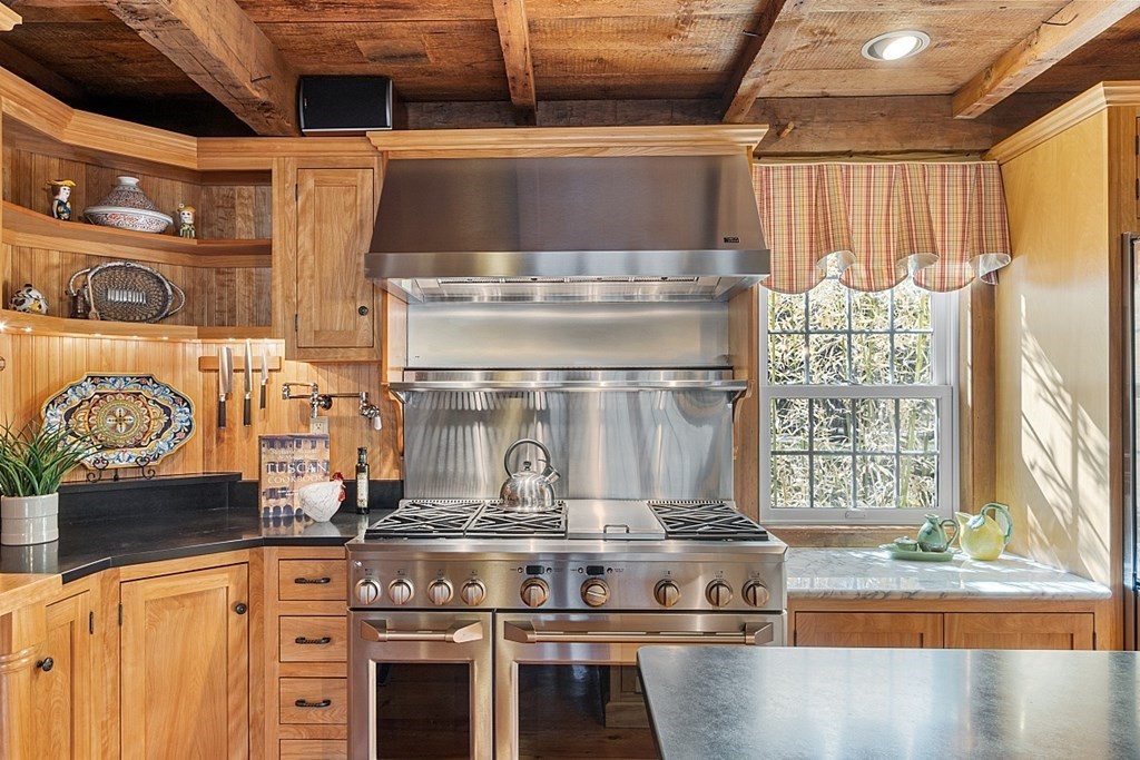 65 Lawrence Road Boxford, MA 01921 - Photo 7 of 36 a stove top oven sitting inside of a kitchen