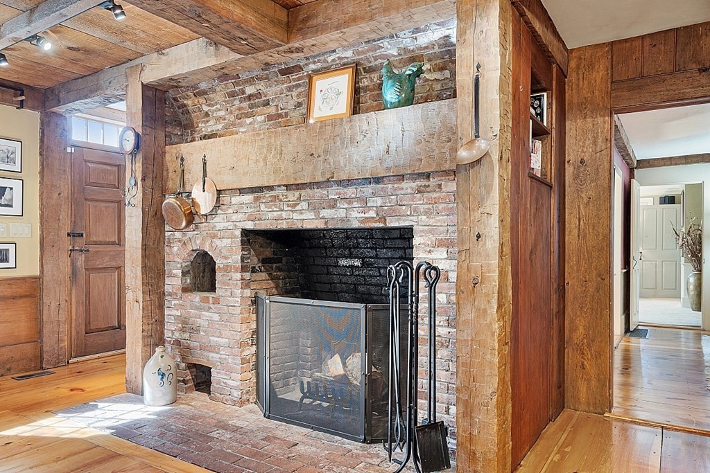 65 Lawrence Road Boxford, MA 01921 - Photo 8 of 36 a view of a livingroom with a fireplace and window