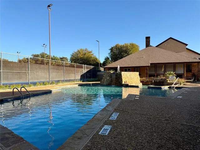 a view of a swimming pool with a lounge chairs
