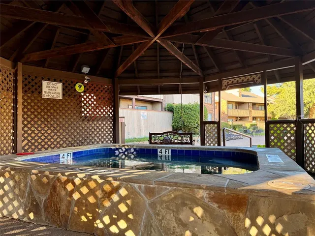 a room with pool table and windows