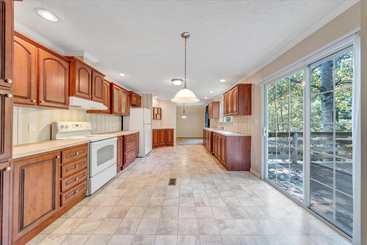 460 White Oak Road Boones Mill, VA 24065 - Photo 14 of 45 a large kitchen with kitchen island granite countertop a large counter top stainless steel appliances and cabinets