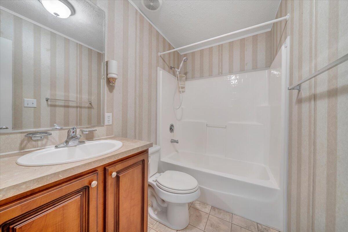 460 White Oak Road Boones Mill, VA 24065 - Photo 23 of 45 a bathroom with a sink a toilet and shower