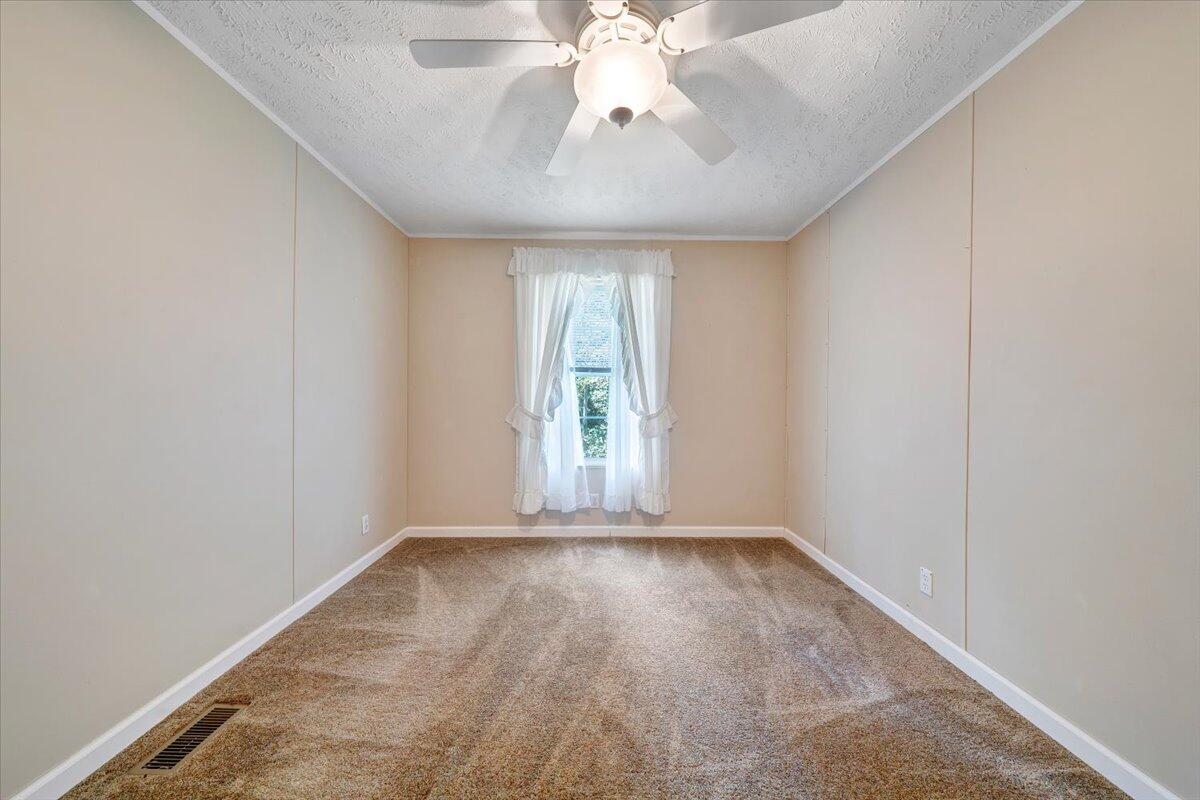 460 White Oak Road Boones Mill, VA 24065 - Photo 25 of 45 wooden floor in an empty room with a window