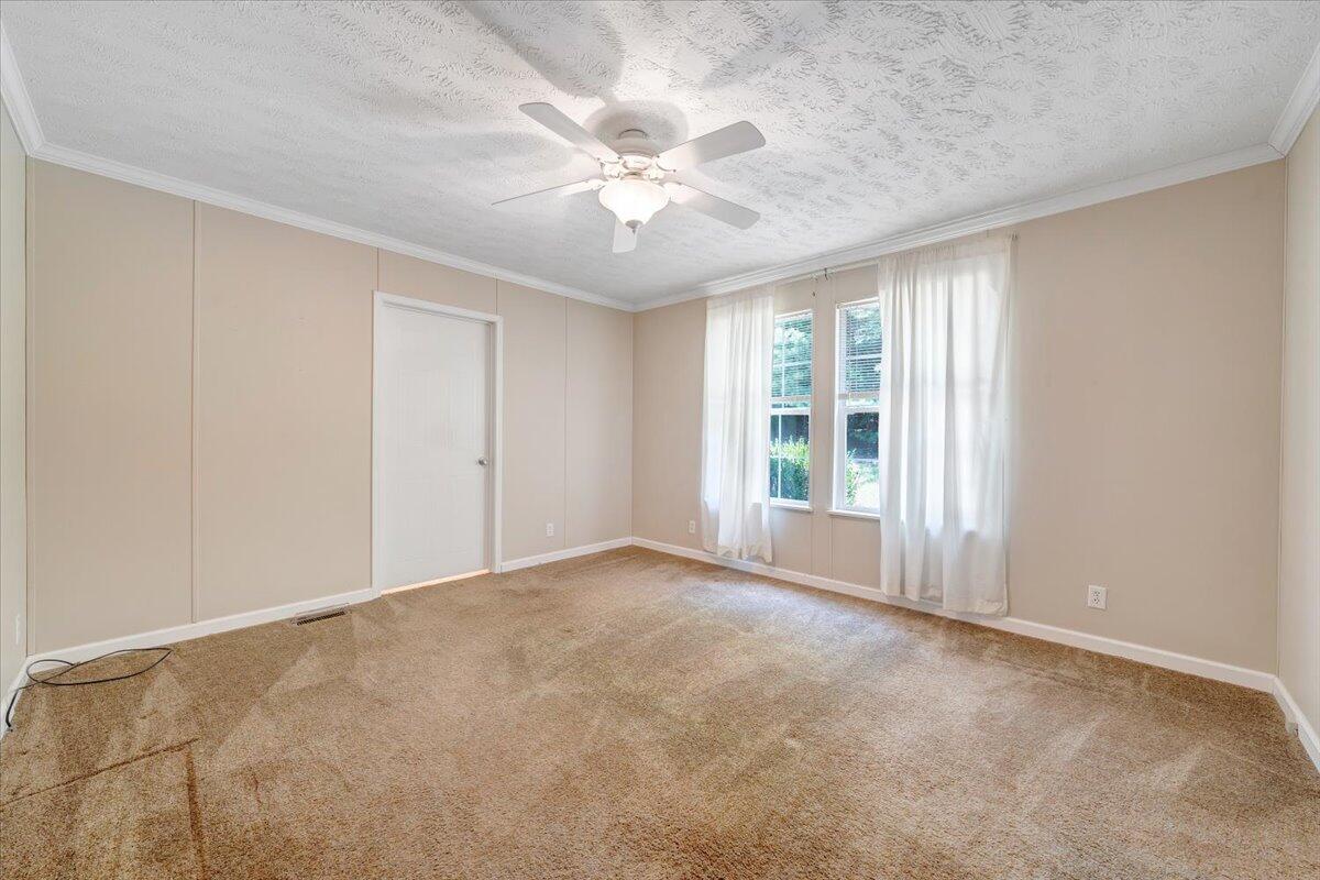 460 White Oak Road Boones Mill, VA 24065 - Photo 27 of 45 wooden floor in an empty room with a window