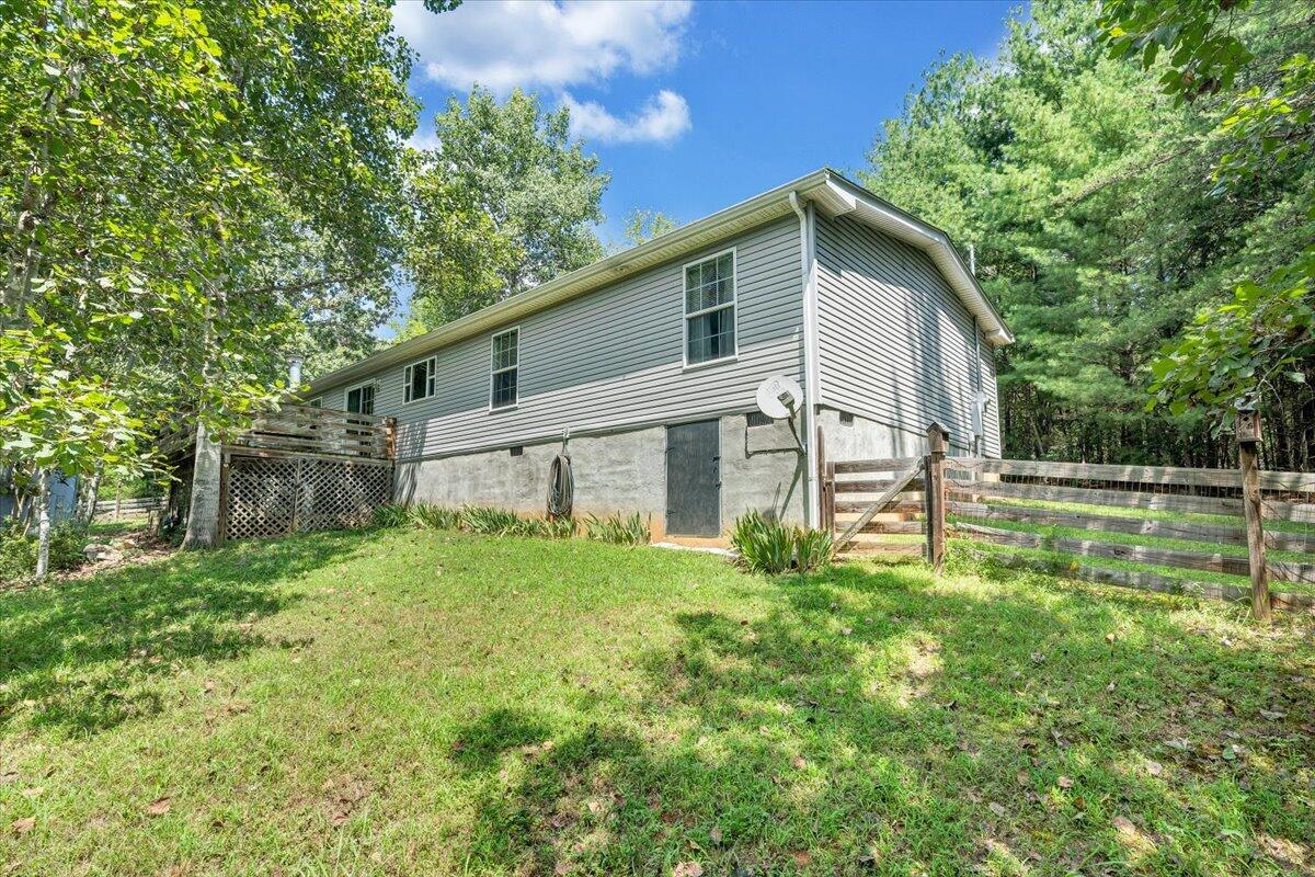 460 White Oak Road Boones Mill, VA 24065 - Photo 39 of 45 a view of a backyard with plants and large tree