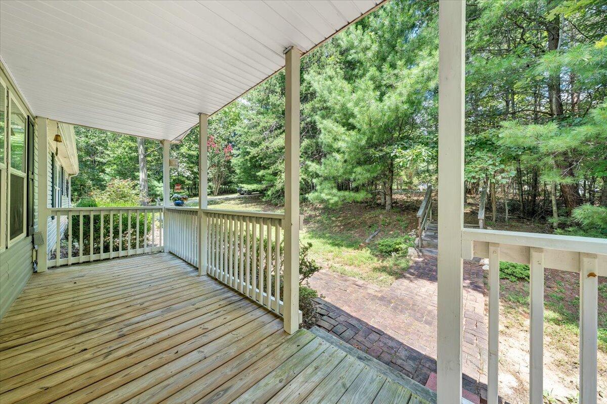 460 White Oak Road Boones Mill, VA 24065 - Photo 4 of 45 a view of a wooden deck with a yard