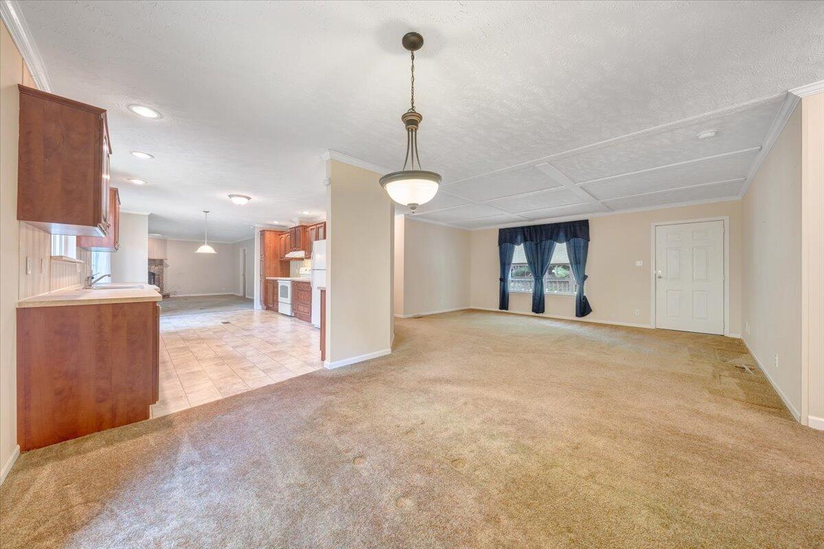 460 White Oak Road Boones Mill, VA 24065 - Photo 7 of 45 a view of a kitchen with a sink and a chandelier
