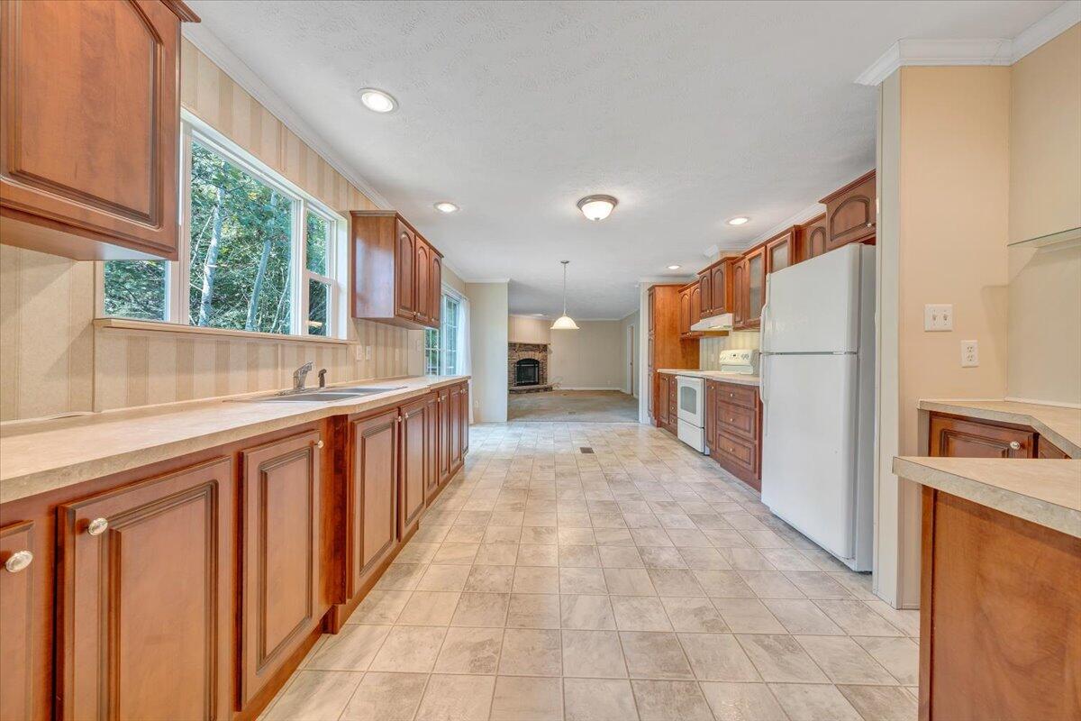 460 White Oak Road Boones Mill, VA 24065 - Photo 9 of 45 a kitchen with stainless steel appliances a refrigerator and a sink