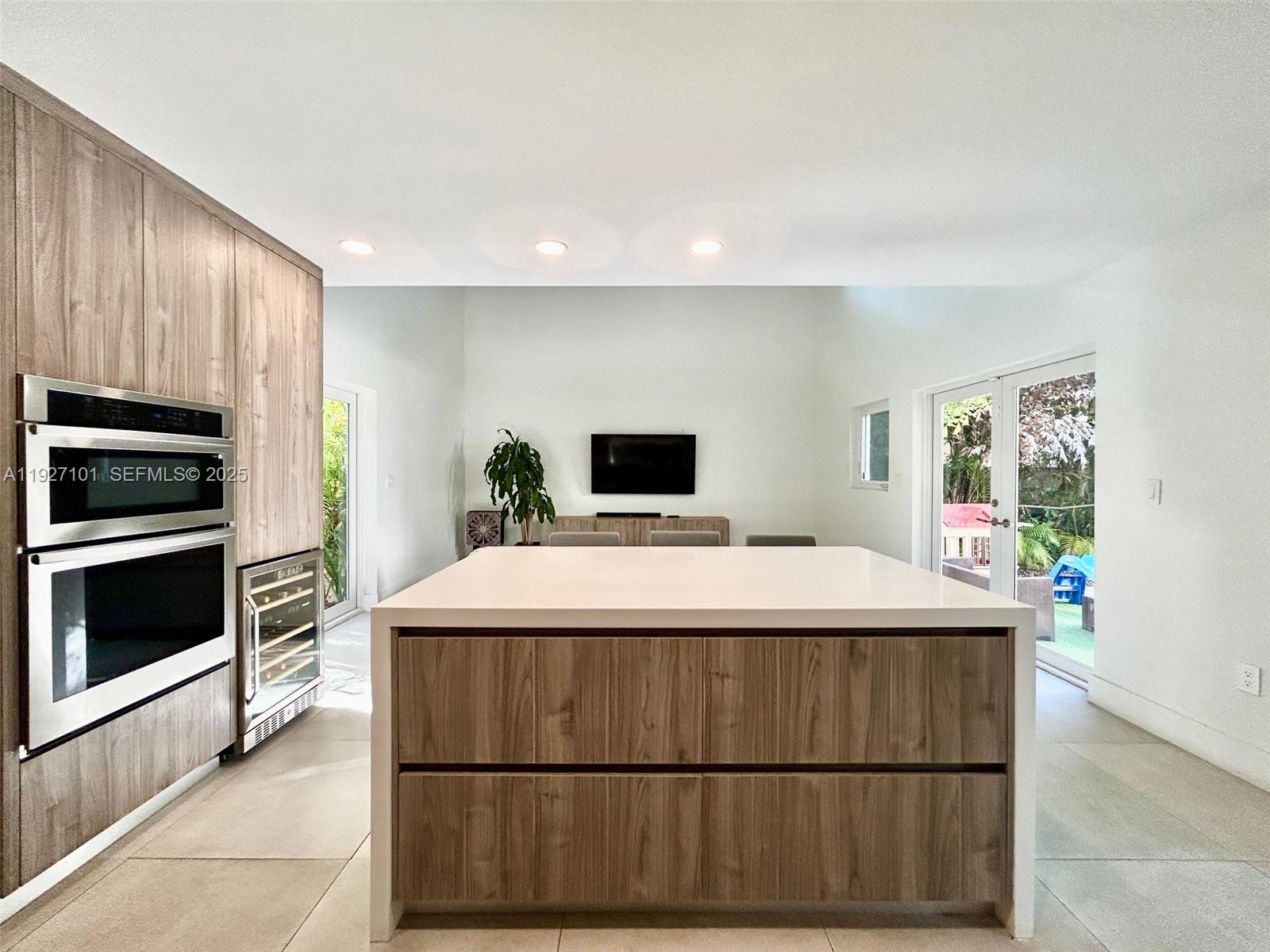 4445 Red Road Coral Gables, FL 33146 - Photo 12 of 41 a room with a bed and a television