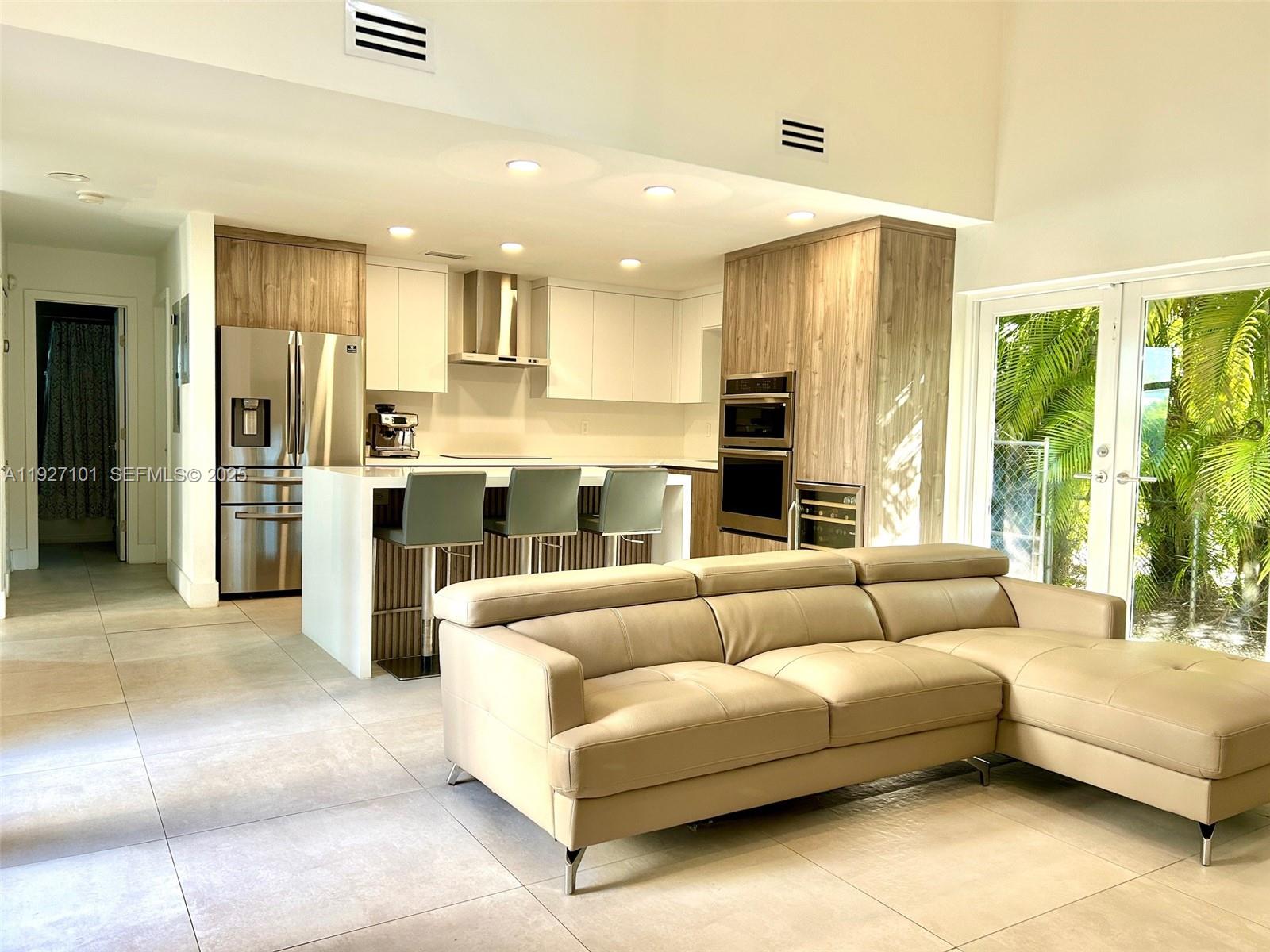 4445 Red Road Coral Gables, FL 33146 - Photo 15 of 41 a living room with furniture and a large window