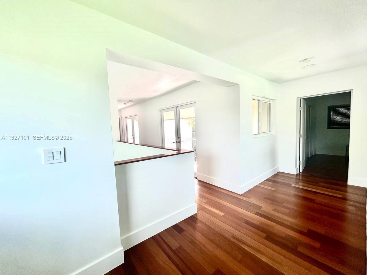 4445 Red Road Coral Gables, FL 33146 - Photo 25 of 41 a view of empty room with wooden floor