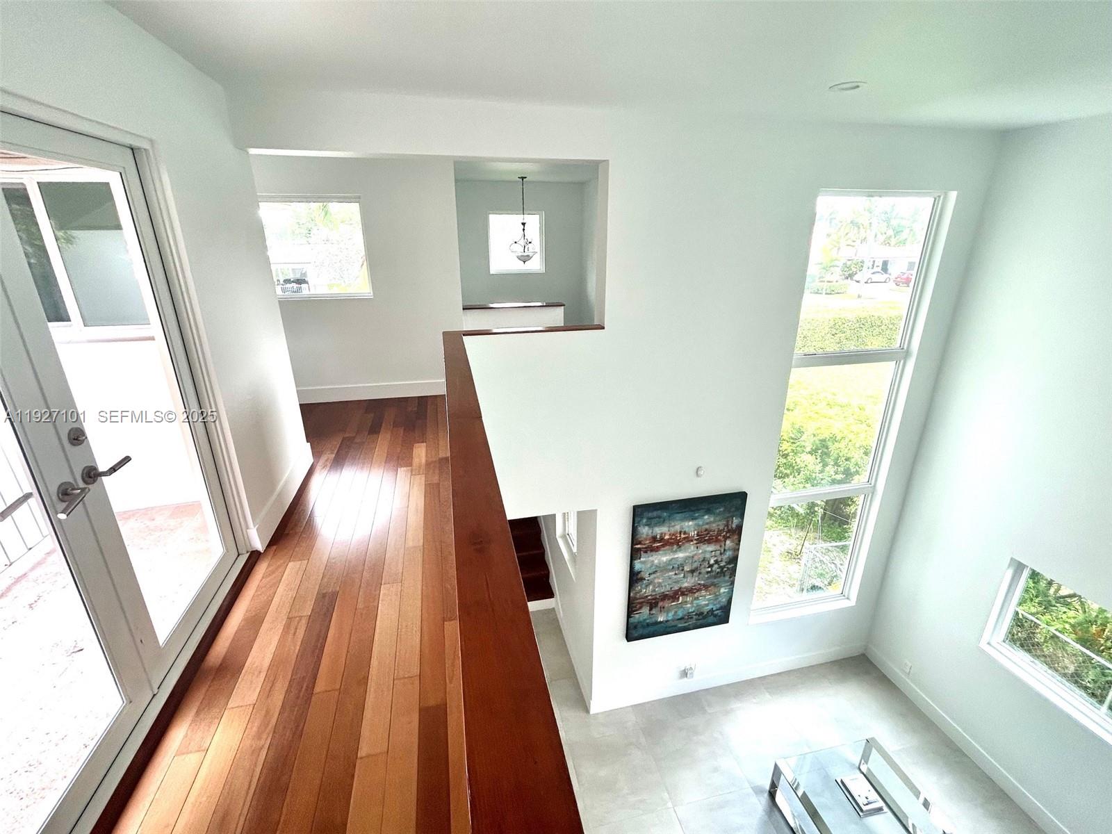 4445 Red Road Coral Gables, FL 33146 - Photo 26 of 41 a view of an entryway with wooden floor and a window