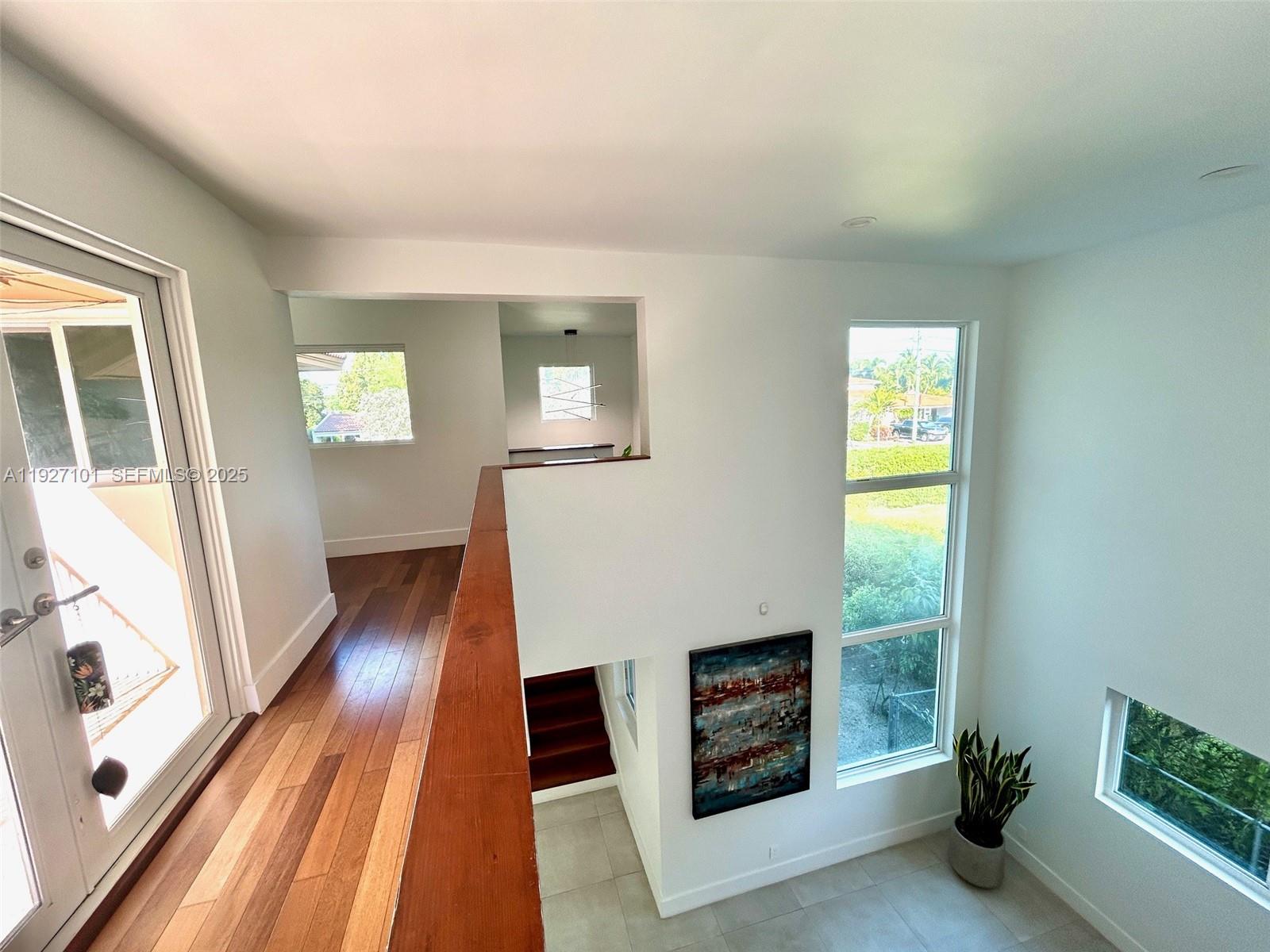 4445 Red Road Coral Gables, FL 33146 - Photo 30 of 41 a view of an entryway with wooden floor and a window