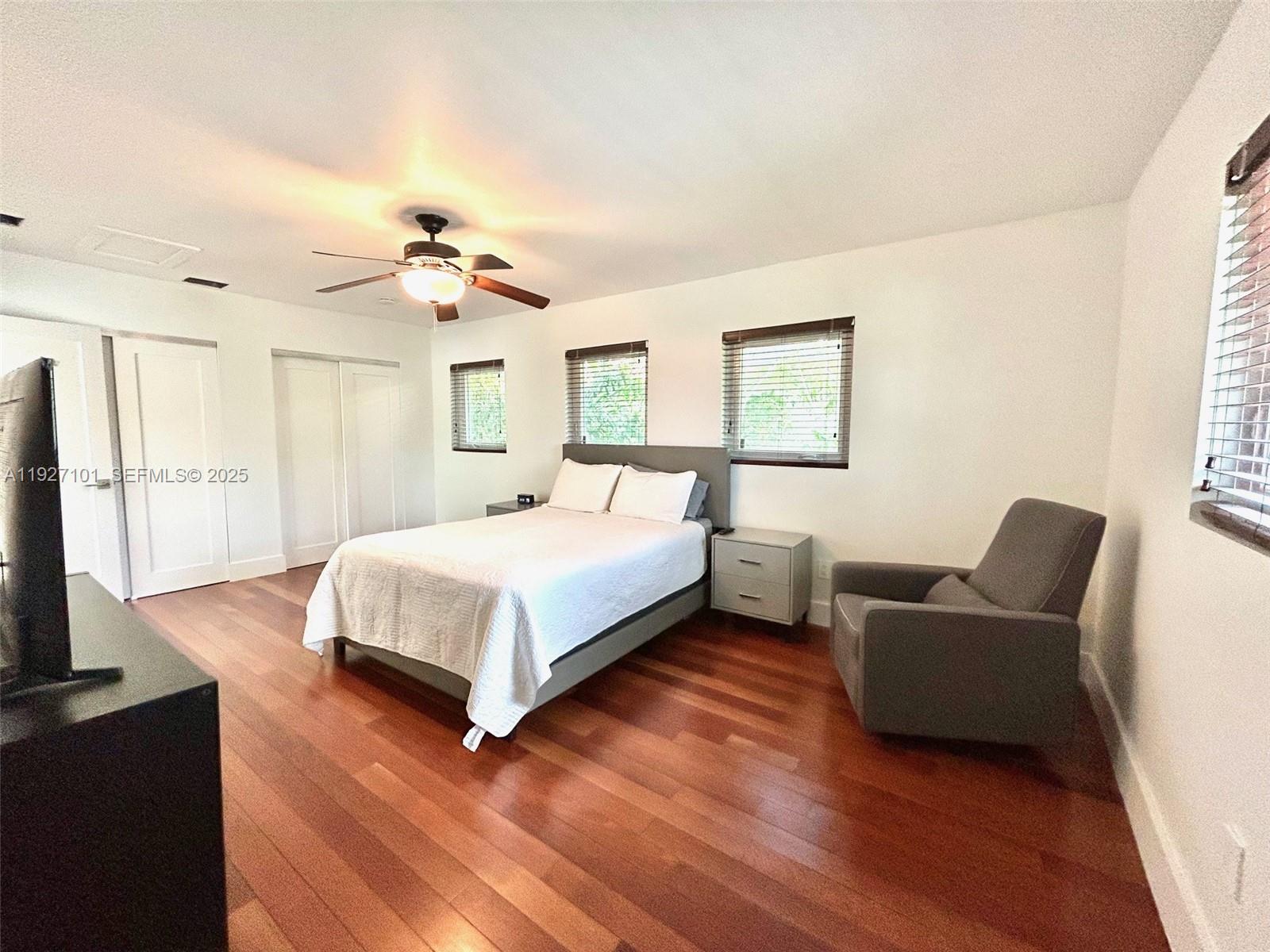 4445 Red Road Coral Gables, FL 33146 - Photo 38 of 41 a bedroom with a bed flat screen tv and window