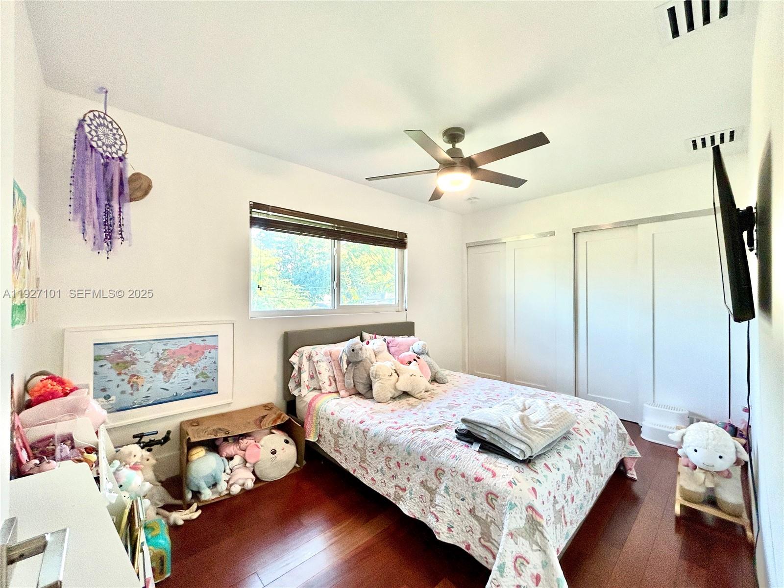 4445 Red Road Coral Gables, FL 33146 - Photo 40 of 41 a bedroom with a bed and wooden floor