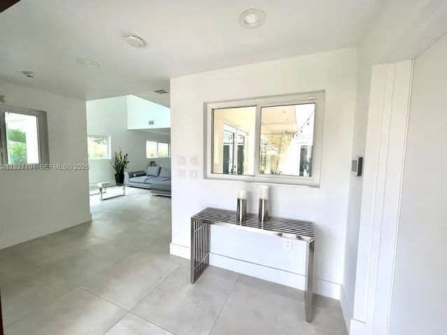 a spacious bathroom with a tub and a sink