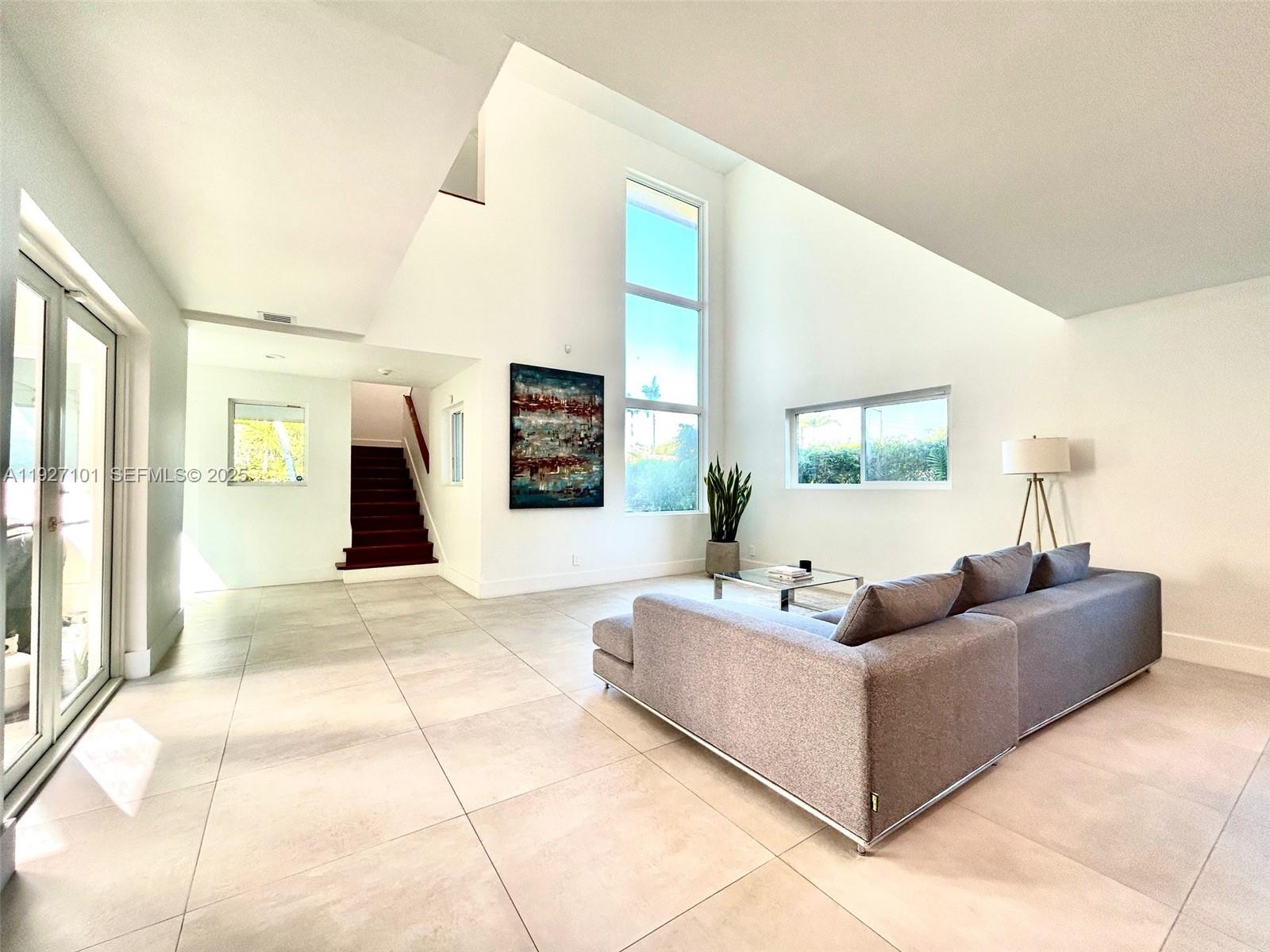 4445 Red Road Coral Gables, FL 33146 - Photo 6 of 41 a living room with furniture and a table