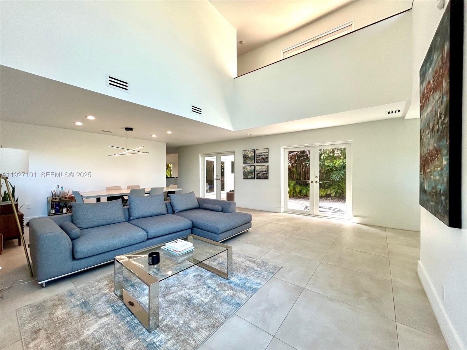 4445 Red Road Coral Gables, FL 33146 - Photo 7 of 41 a living room with furniture and a large window