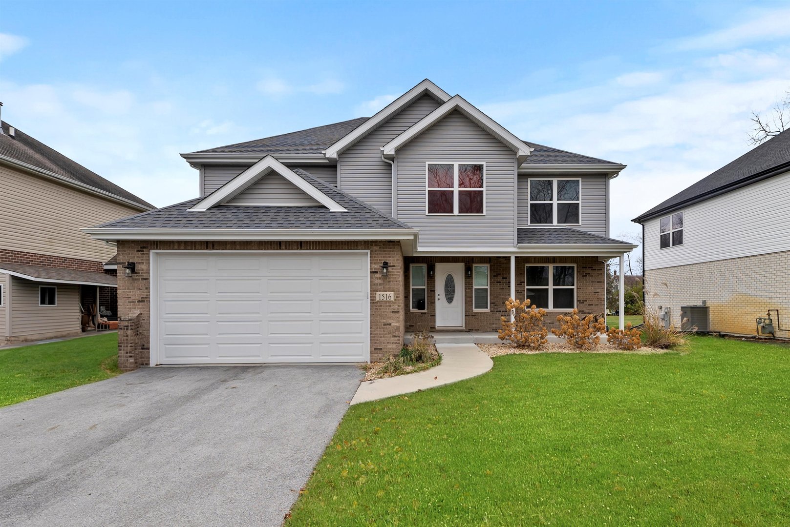 1516 Perry Street Crete, IL 60417 - Photo 1 of 35 a front view of a house with garden