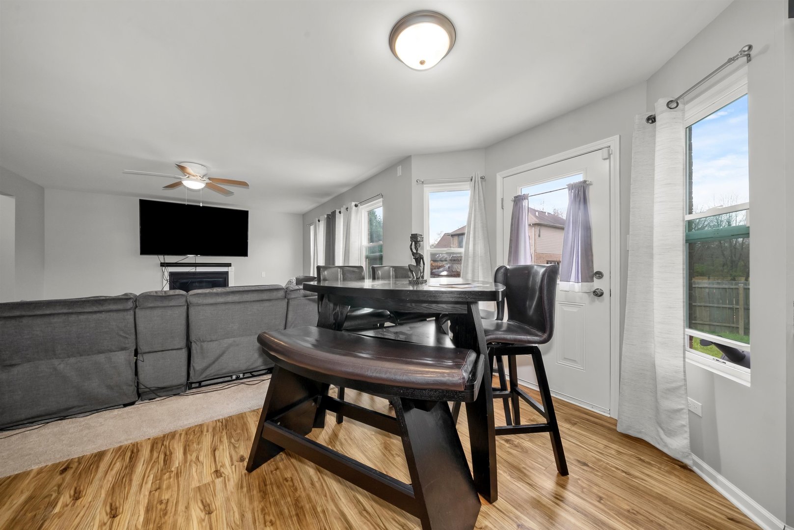 1516 Perry Street Crete, IL 60417 - Photo 11 of 35 a view of a dining room with furniture and wooden floor