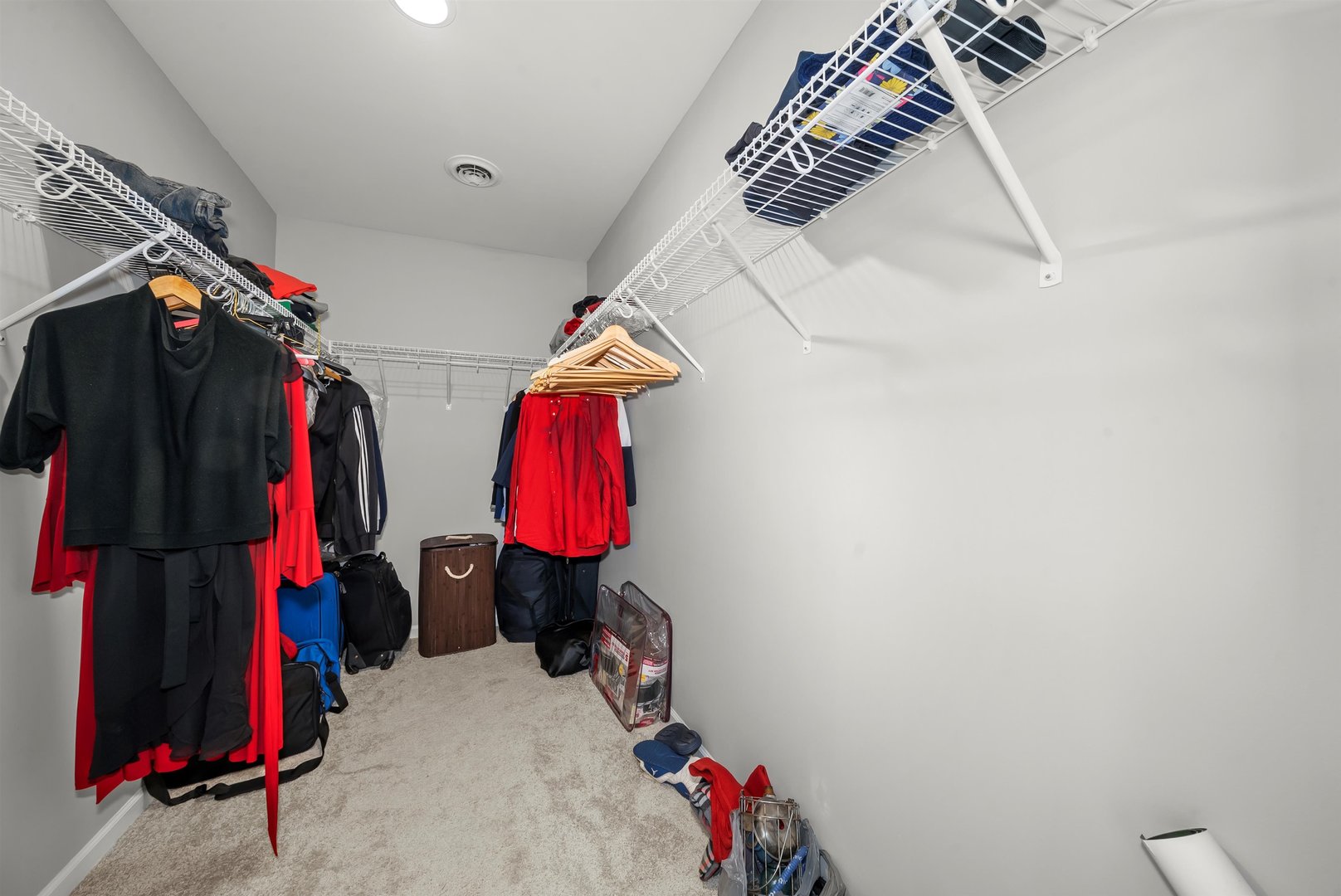 1516 Perry Street Crete, IL 60417 - Photo 17 of 35 a view of walk in closet with clothes