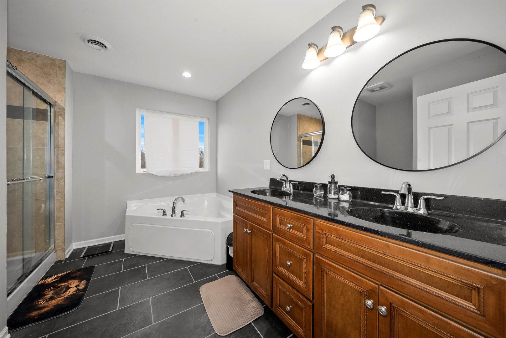 1516 Perry Street Crete, IL 60417 - Photo 18 of 35 a bathroom with a double vanity sink and a mirror