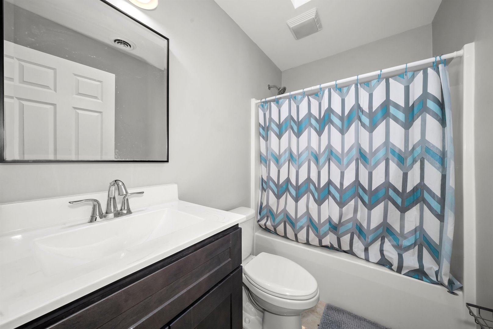 1516 Perry Street Crete, IL 60417 - Photo 20 of 35 a bathroom with a toilet a sink and a shower curtain