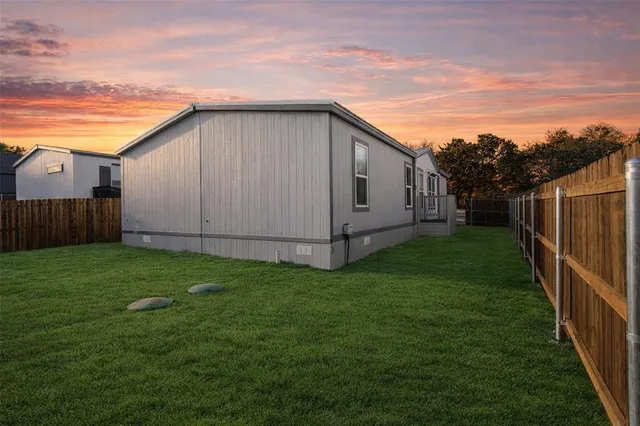 a view of a backyard with potted plants