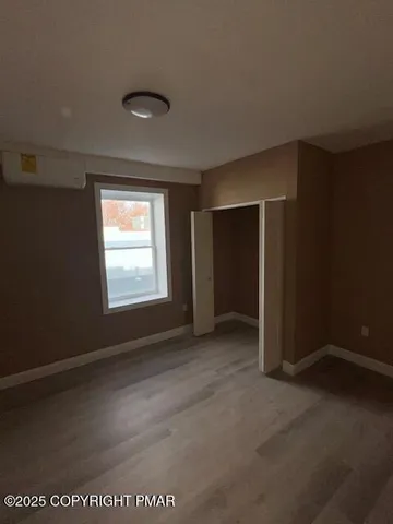 a bathroom with a tub and shower