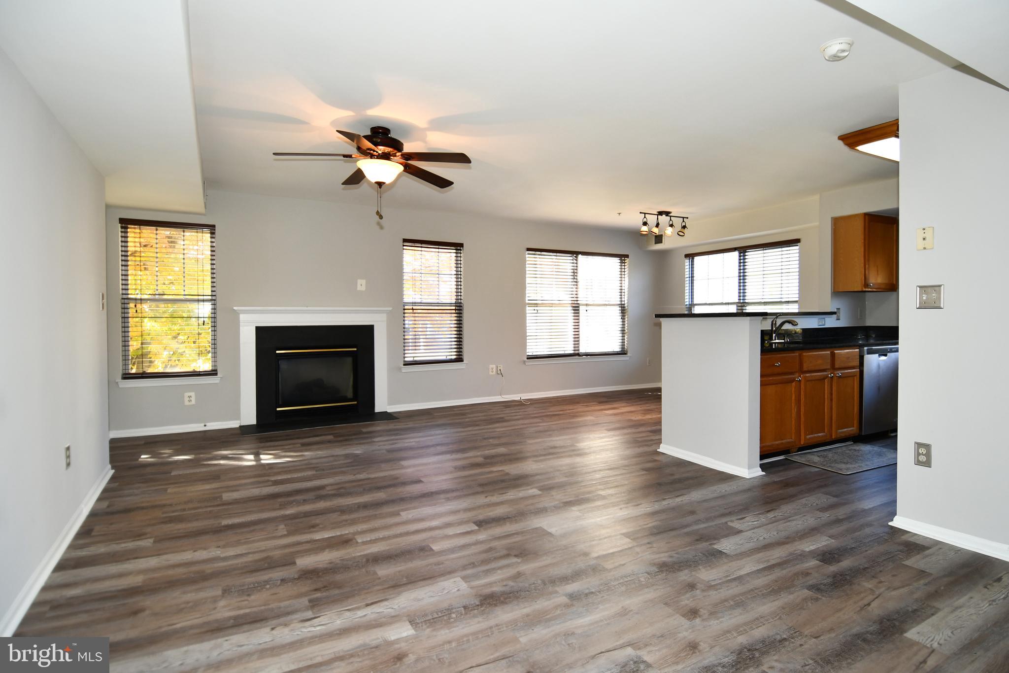 14100 Farnsworth Lane, Unit 2202 Upper Marlboro, MD 20772 - Photo 2 of 38 a view of empty room with wooden floor and fan cabinet