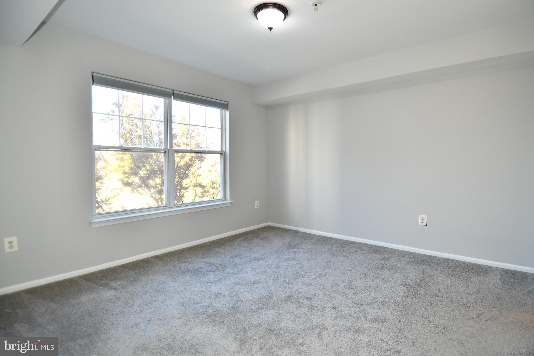 14100 Farnsworth Lane, Unit 2202 Upper Marlboro, MD 20772 - Photo 24 of 38 an empty room with a window