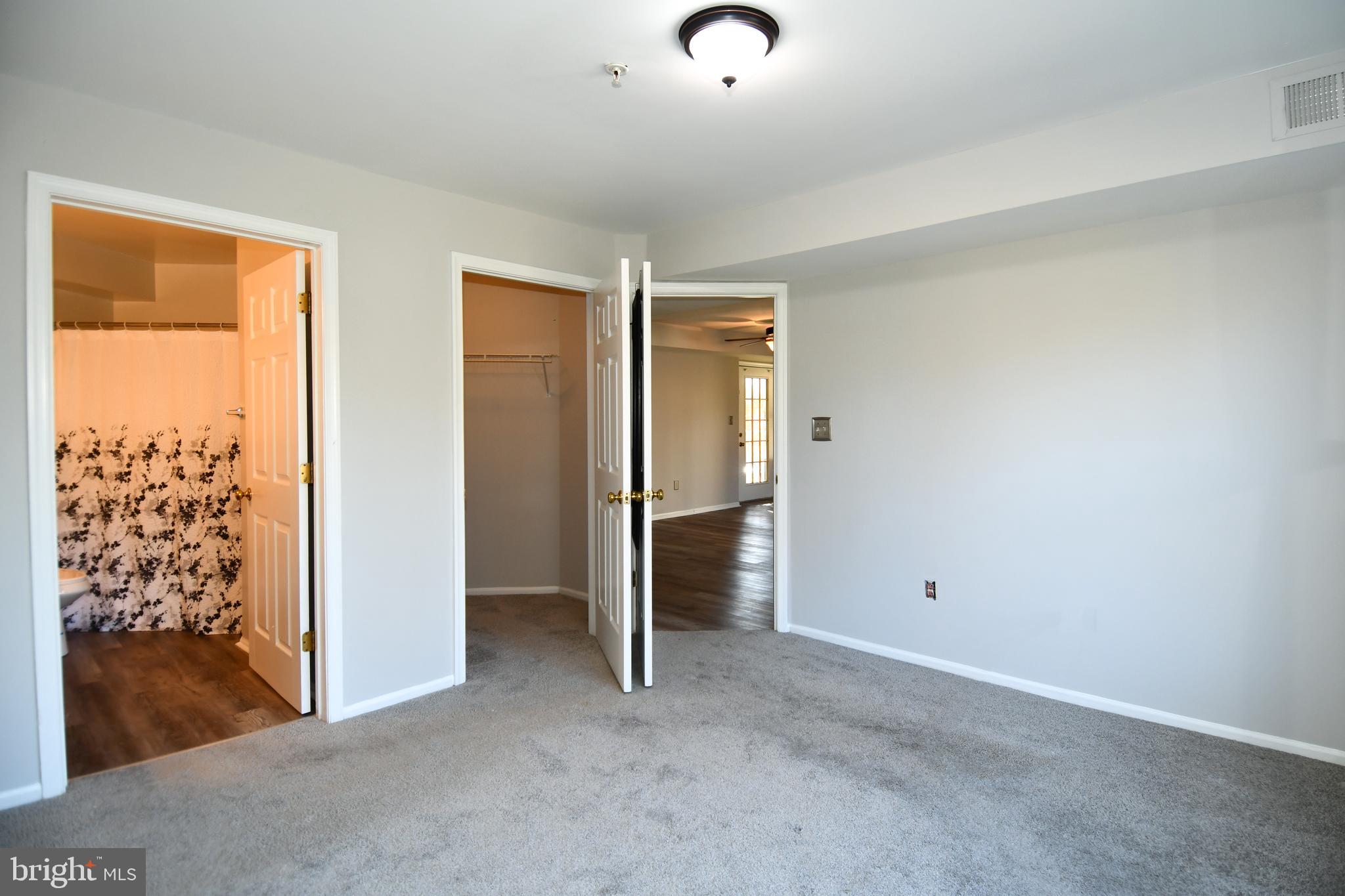 14100 Farnsworth Lane, Unit 2202 Upper Marlboro, MD 20772 - Photo 28 of 38 an empty room with a natural light
