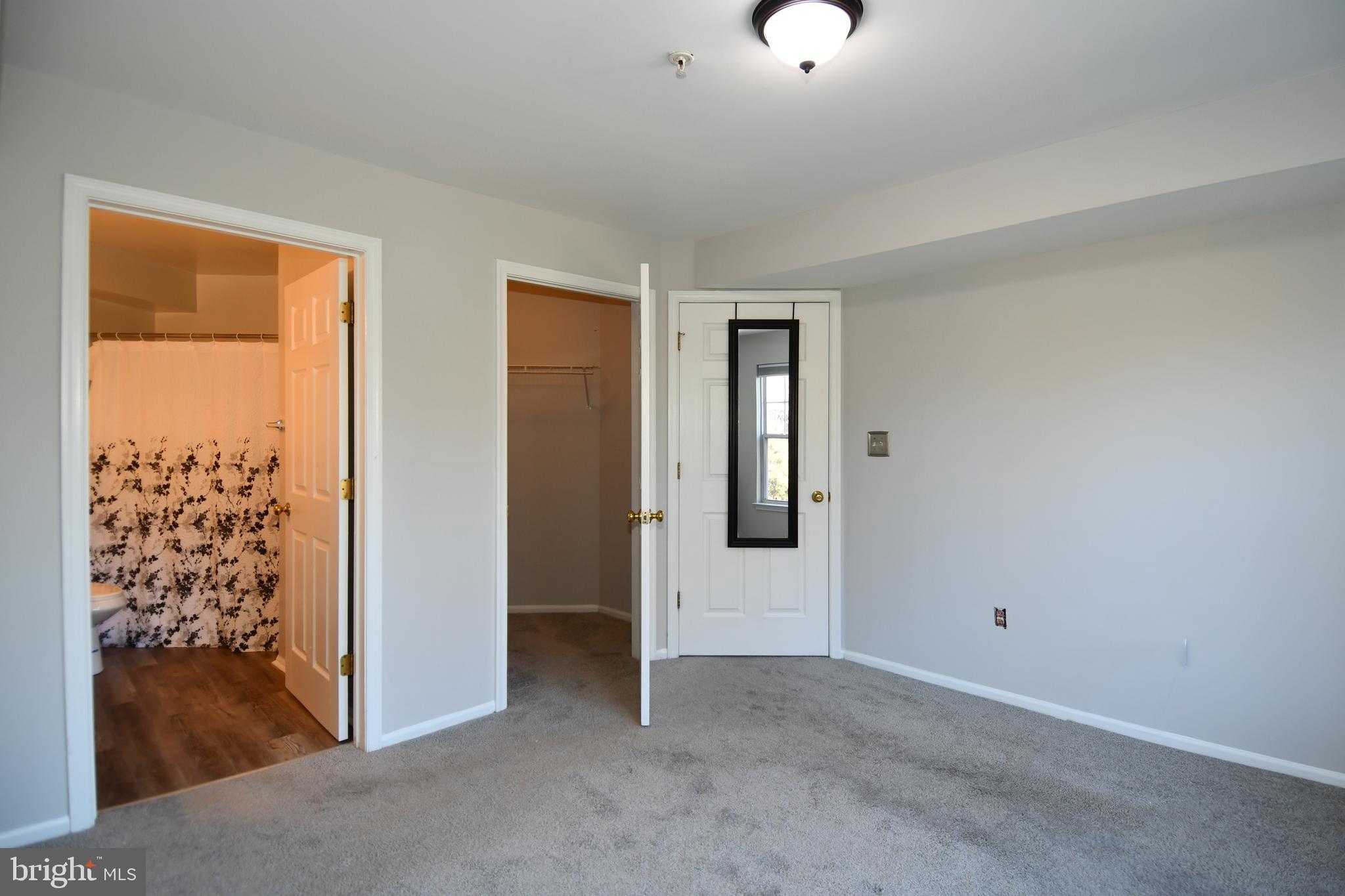 14100 Farnsworth Lane, Unit 2202 Upper Marlboro, MD 20772 - Photo 29 of 38 a view of an empty room and window
