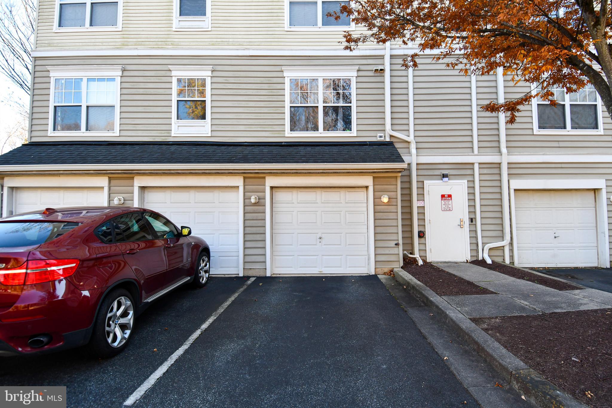 14100 Farnsworth Lane, Unit 2202 Upper Marlboro, MD 20772 - Photo 33 of 38 a front view of a house with a garage