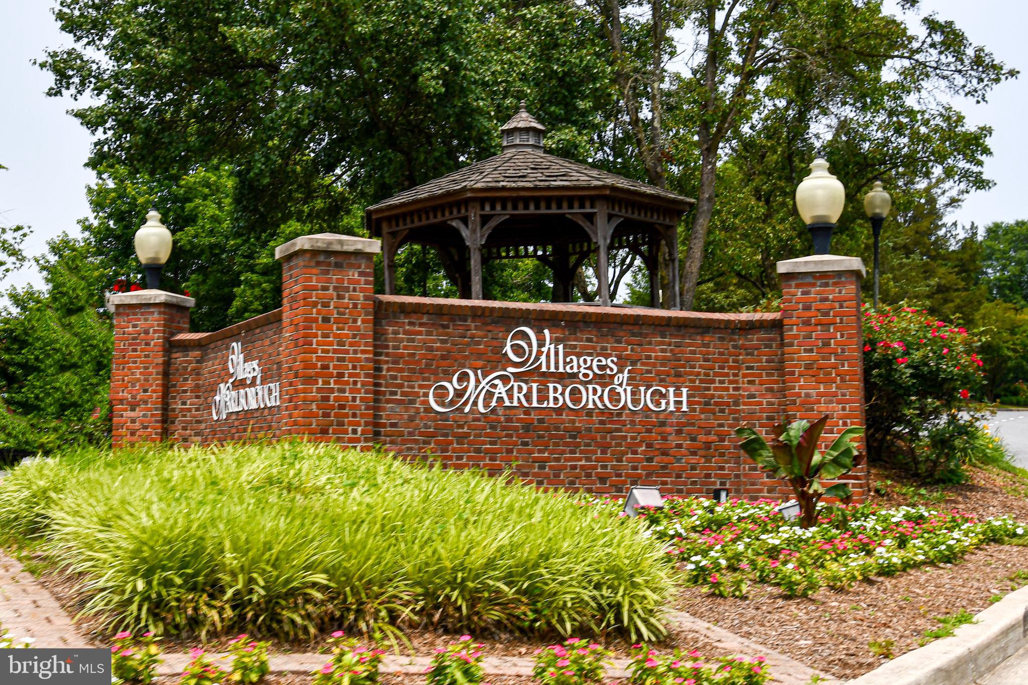 14100 Farnsworth Lane, Unit 2202 Upper Marlboro, MD 20772 - Photo 35 of 38 a view of front of house with sign board and yard