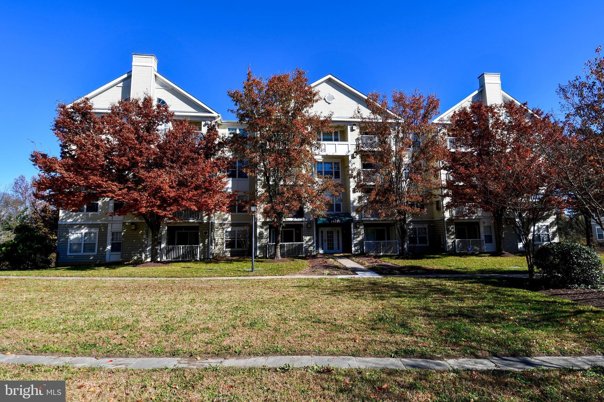 14100 Farnsworth Lane, Unit 2202 Upper Marlboro, MD 20772 - Photo 5 of 38 a front view of a building with a yard
