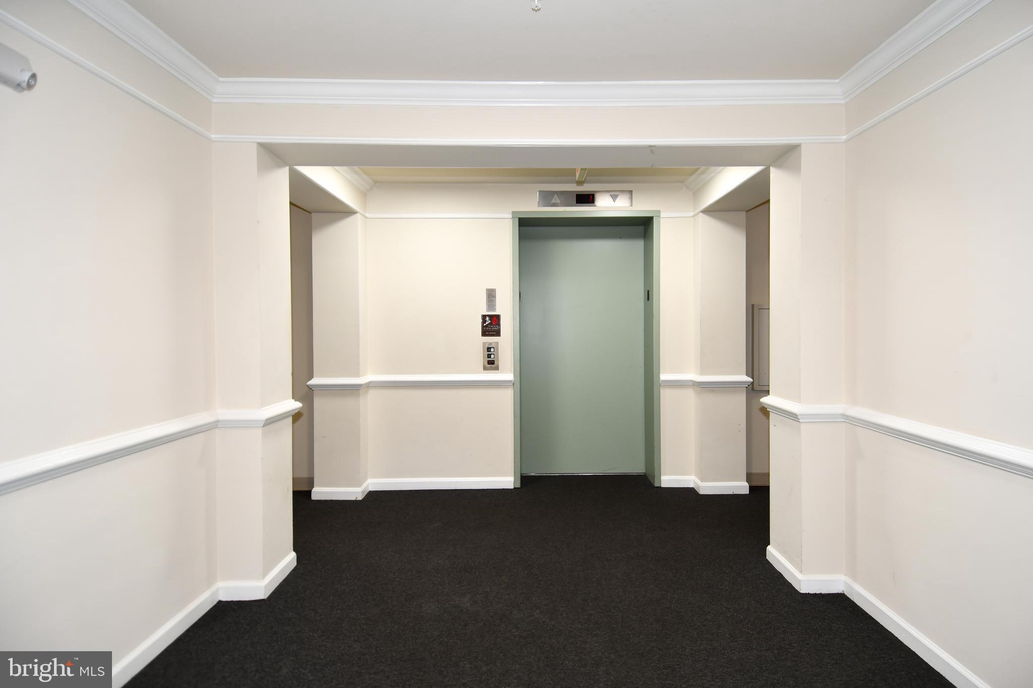 14100 Farnsworth Lane, Unit 2202 Upper Marlboro, MD 20772 - Photo 7 of 38 a view of empty room with wooden floor