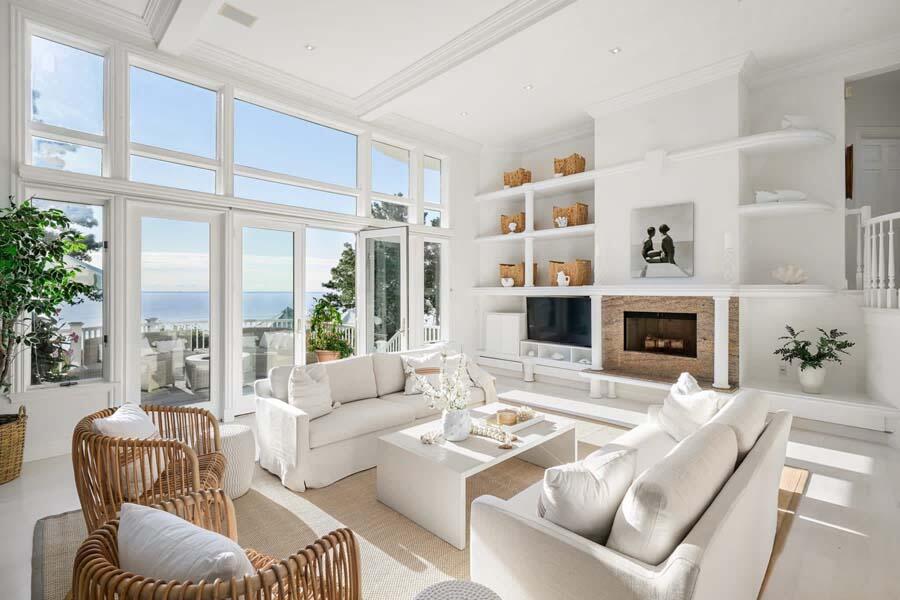 27 Ocean Bluff Drive Mashpee, MA 02649 - Photo 11 of 55 a living room with furniture fireplace and a large window