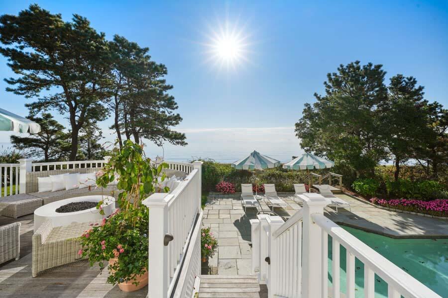 27 Ocean Bluff Drive Mashpee, MA 02649 - Photo 21 of 55 a view of a patio with iron fence
