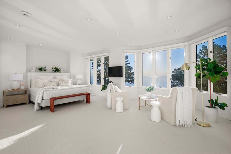 27 Ocean Bluff Drive Mashpee, MA 02649 - Photo 25 of 55 a bedroom with furniture and a flat screen tv