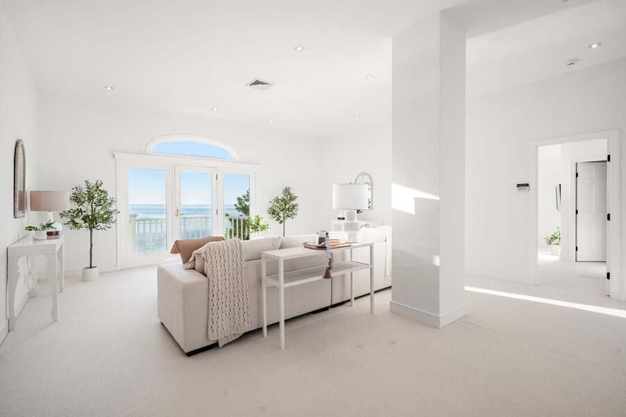 27 Ocean Bluff Drive Mashpee, MA 02649 - Photo 27 of 55 a living room with furniture and a large window