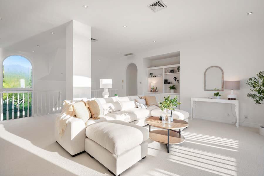 27 Ocean Bluff Drive Mashpee, MA 02649 - Photo 30 of 55 a living room with furniture a chandelier and a window