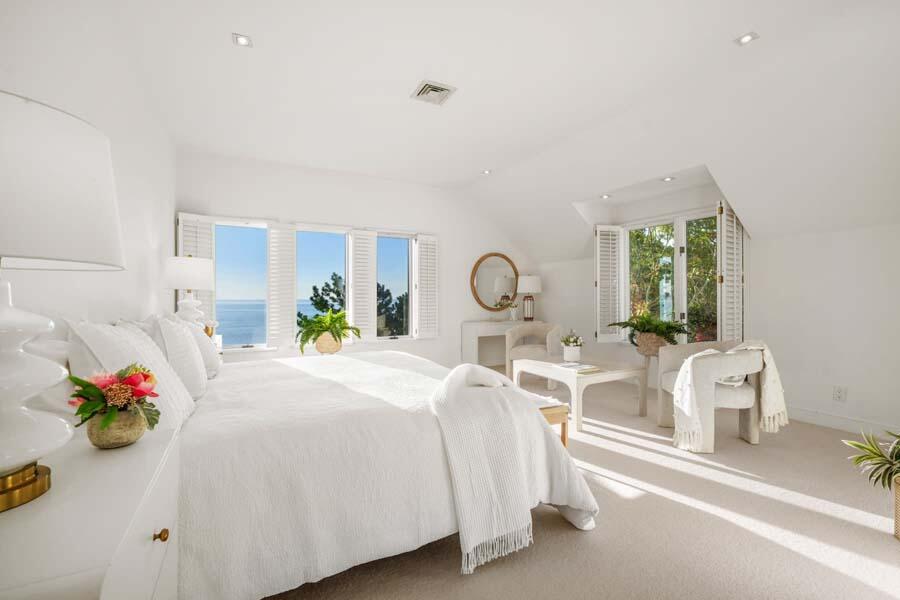 27 Ocean Bluff Drive Mashpee, MA 02649 - Photo 33 of 55 a bedroom with furniture and a large window