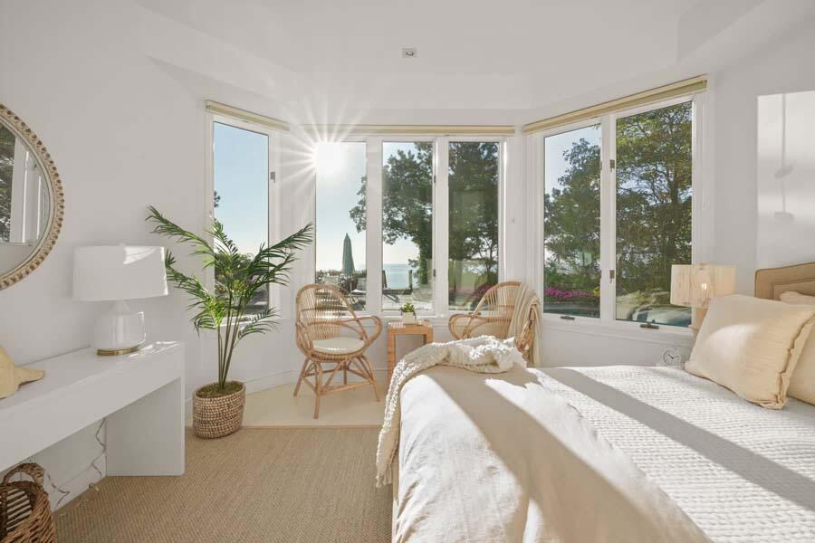 27 Ocean Bluff Drive Mashpee, MA 02649 - Photo 38 of 55 a living room with furniture and large windows